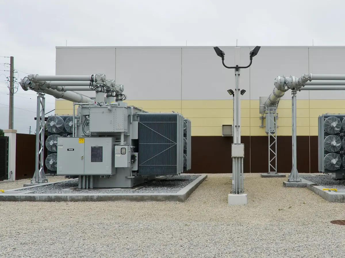 A technician servicing industrial switchgear