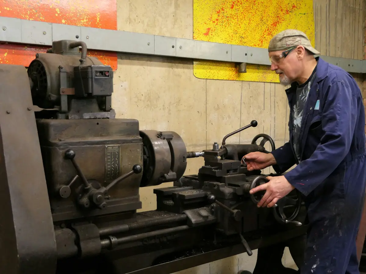 A technician performing in-place machining on heavy plant equipment