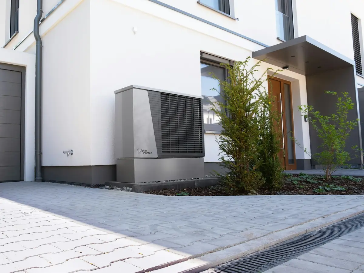 A standby generator installed beside a home